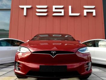 NETHERLANDS-US-ECONOMY-AUTO-TESLA The logo marks the showroom and service center for the US automotive and energy company Tesla in Amsterdam on October 23, 2019. (Photo by JOHN THYS / AFP) (Photo by JOHN THYS/AFP via Getty Images)